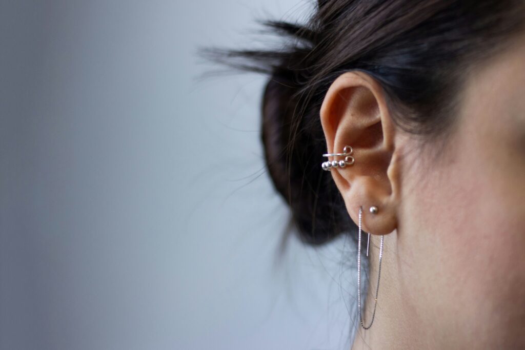 Why Are Piercing Guns Bad? covering blunt-force trauma, contamination risks, swelling, healing complications, piercing guns, and sterile needles.