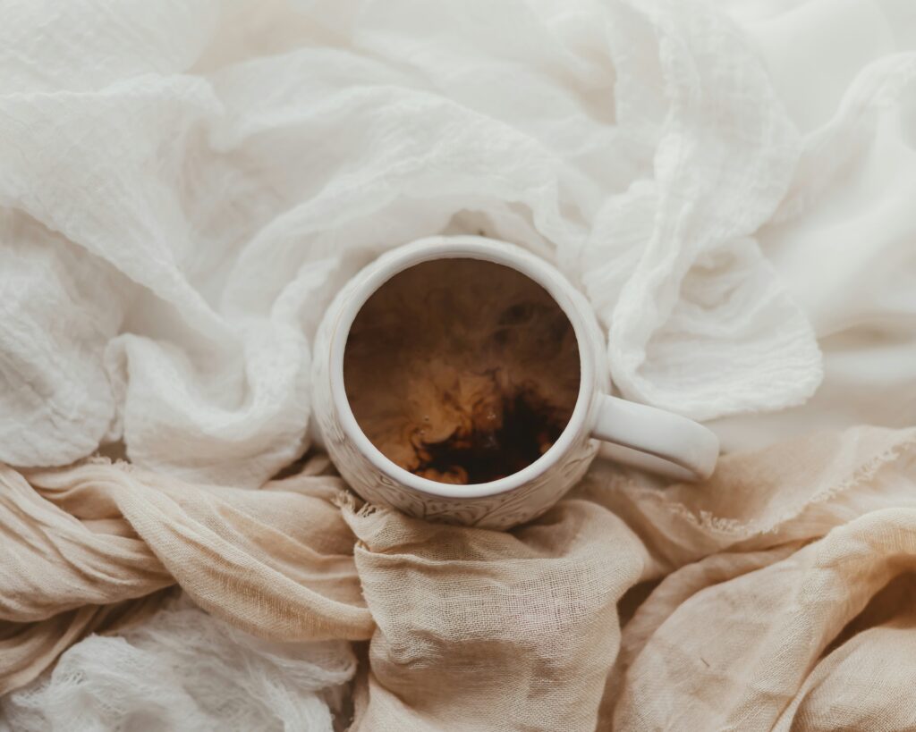 How to Get Coffee Stains Out of Clothes covering fresh spills, dried coffee stains, detergent treatment, fabric care, and laundry techniques.